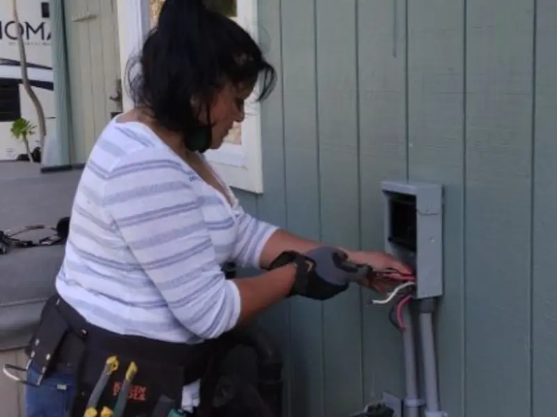 Licensed electrician wiring an exterior subpanel in Margate City