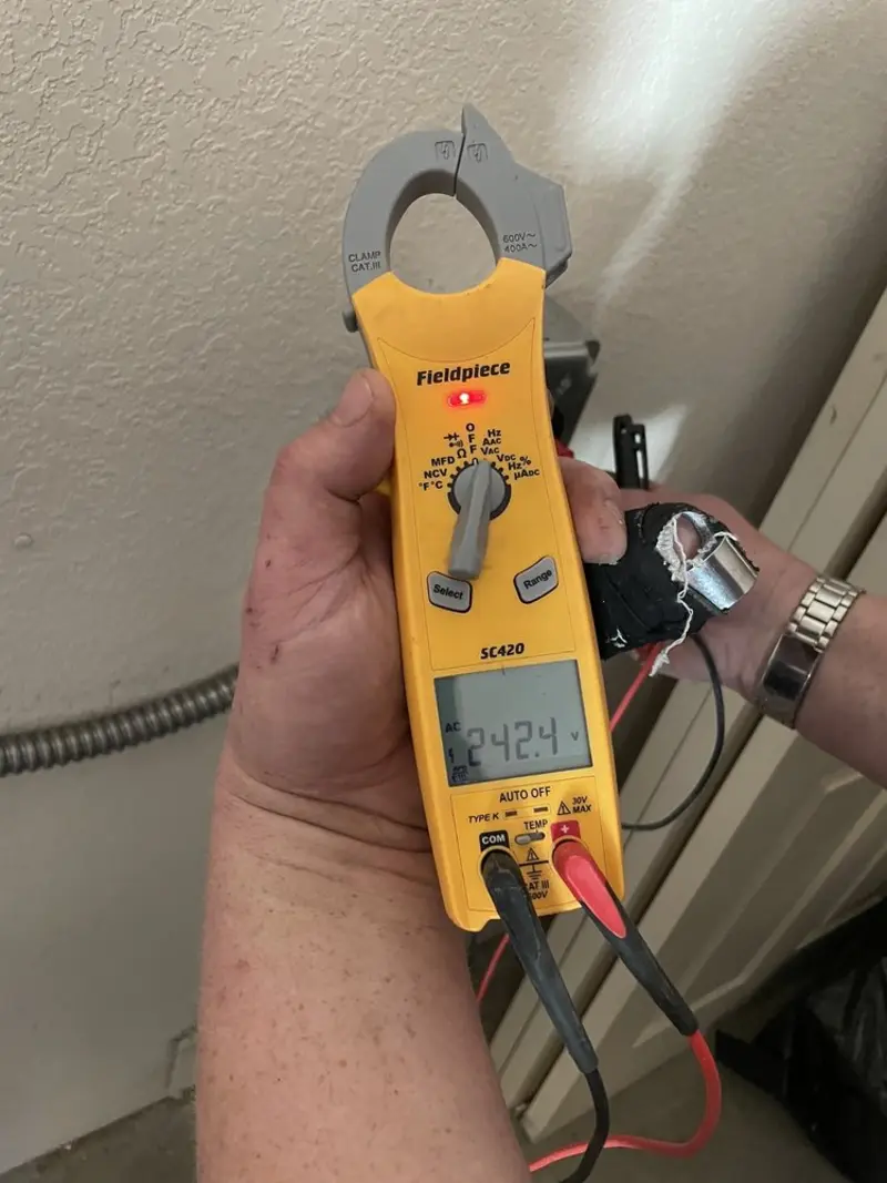 Voltage testing with clamp meter during Recessed Lighting Installation in Margate City